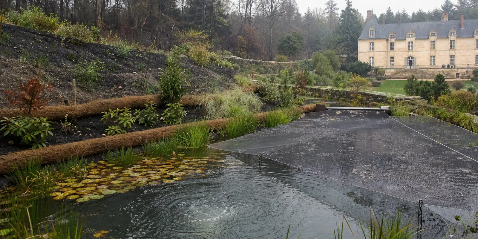Garden pond with fine mesh, aeration and contour barriers after ash fallout